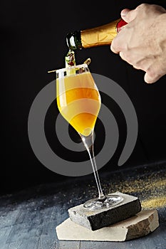 Macro Photo of Bartender Hand Preparing Classic Bellini Cocktail