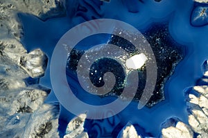 Macro photo of a blue agate rock slice.