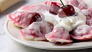 macro photo of cherry dumplings covered with sour cream with steam in a plate on a white mar