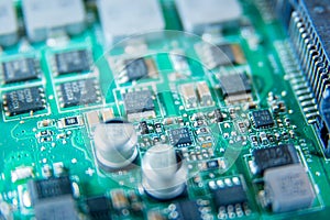 Macro photo of a circuit board detail with various components and integrated circuits