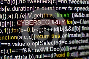 Macro photo of computer screen with program source code and highlighted CYBERSECURITY inscription in the middle. Script