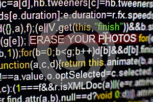Macro photo of computer screen with program source code and highlighted SPYWARE inscription in the middle. Script on the