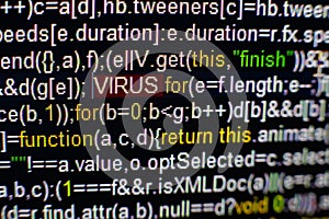 Macro photo of computer screen with program source code and highlighted VIRUS inscription in the middle. Script on the