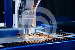 Macro photo cutting of metal CNC Laser engraving. Concept background modern industrial technology