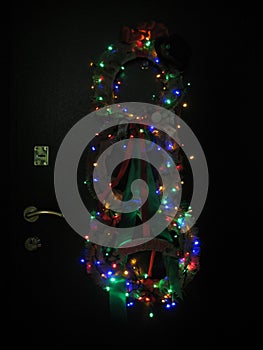 macro photo with decorative background decorations in the form of wreaths with a light garland on the door for design