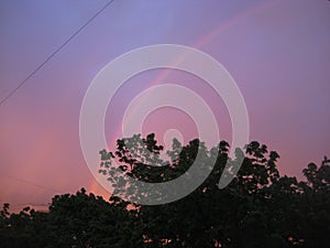 Macro photo with a decorative background of a natural physical phenomenon of a rainbow in the sky with the decomposition of light