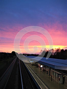 Macro photo with decorative colorful background of the outdoor subway station at sunset in a European city