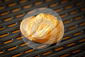 Macro photo of delicious roasted and peeled chestnut on grill