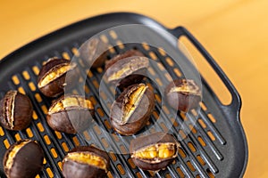 Macro photo of delicious roasted and peeled chestnuts (castanea sativa) on grill