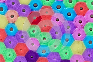 Macro photo of different colored plastic beads