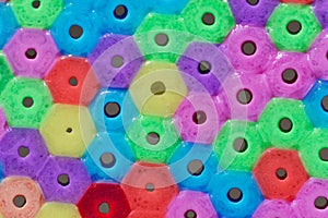 Macro photo of different colored plastic beads