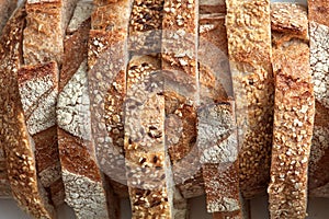 Macro photo of different pieces of fresh bread with flax seeds and sesame seeds. Healthy food. Flat lay