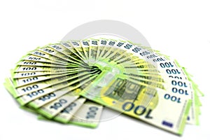 Macro photo of the European Union 100 EURO banknote, bills arranged in a fan, isolated on a white background, selective focus.