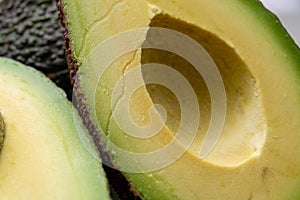 Macro photo, fresh ripe hass avocado, cut in half