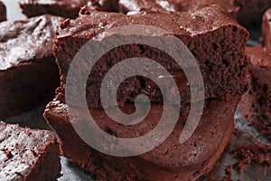 Macro photo of Homemade Chocolate Brownies made from chocolate 80 percentages with chocolate chip 98 percentage inside on dark