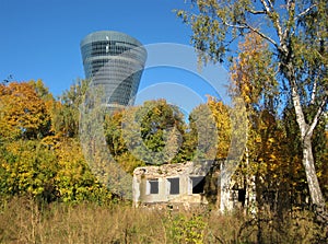 Macro photo with a landscape background of a modern high-rise building and old ruins in a European city park for design