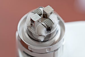 Macro photo of new clapton coil mounted in the electronic cigarette