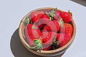 Macro photo of a ripe red large strawberry with a small depth of field