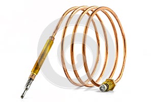 Macro photo of a temperature probe made of copper in the shape of a spiral with threaded tips, isolated on a white background.