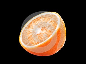 Macro photo of whole fruit orange and slice isolated on black background