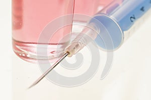 Macro photograph of Syringe and vitamin shot