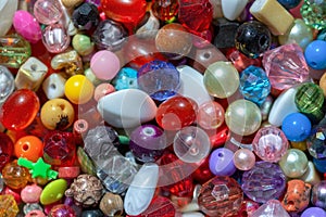 Macro photography of a heap of assorted colorful plastic beads II