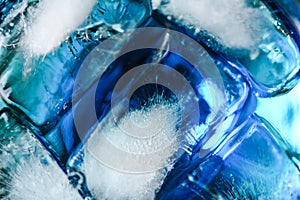 Close up of ice in drink in blue curacao colored drink