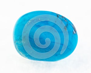 polished blue howlite (turquenite) stone on white photo