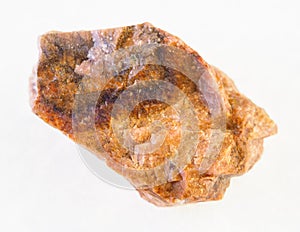 rough orthoclase stone on white photo