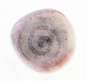 tumbled pink rhodonite stone on white photo