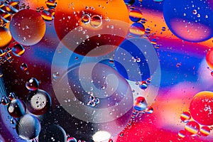 Macro photography of oil bubbles dissolved in water. Colorful background