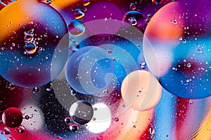 Macro photography of oil bubbles dissolved in water. Colorful background