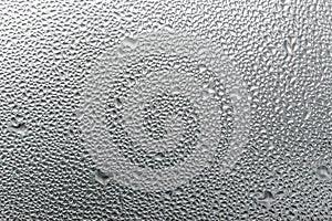Macro photography water drops on glass window white background after the rain.
