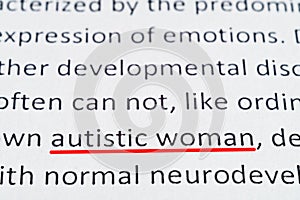 Macro photography of the word autism from the newspaper