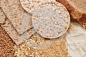 Macro picture of many different kinds of products made from wheat (expanded wheat, diet crisp breads, integral wheat bread) and w