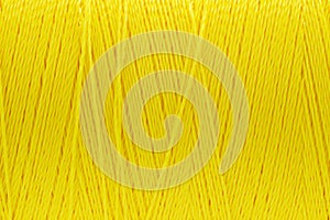 Macro picture of thread texture yellow color background