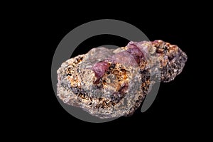 Macro pink Smithsonite mineral stone on microcline on black background