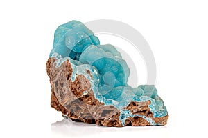 Macro pink Smithsonite mineral stone on microcline on white background