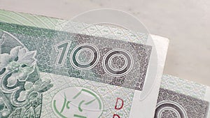 Macro PLN Polish 100 zloty banknotes background. One hundred zloty banknotes detail