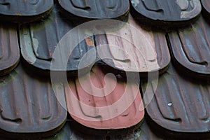 Macro of a roof with alternates colorful shingles photo
