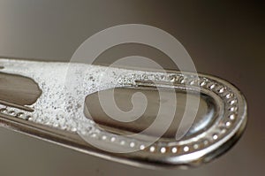 Macro scene of bubble on the spoon handle