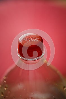 Macro shallow depth of field image selective focus with the plastic bottle cap of a Coca Cola bottle