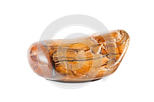 Macro shooting of natural gemstone. Mineral tiger eye, South Africa. Isolated object on a white background.