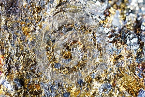 Macro shooting of natural gemstone. The texture of the mineral chalcopyrite. Abstract background.