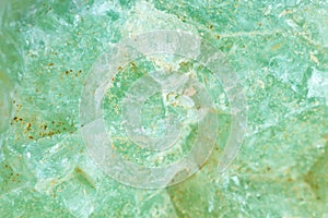 Macro shooting of natural gemstone. The texture of mineral prenit. Abstract background.