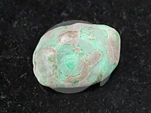 polished Variscite gemstone on dark background photo