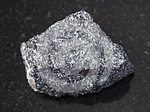 raw Amphibolite stone on dark background photo