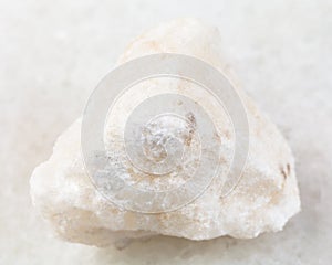 raw anhydrite stone on white photo