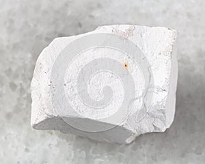 raw chalkstone on white photo