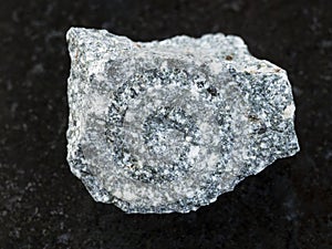 raw Diorite stone on dark background photo